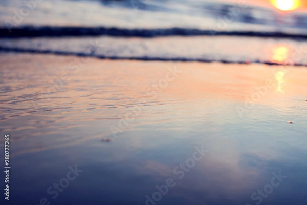 Fototapeta A sunset on the beach. Sea and eveninig sky with clouds