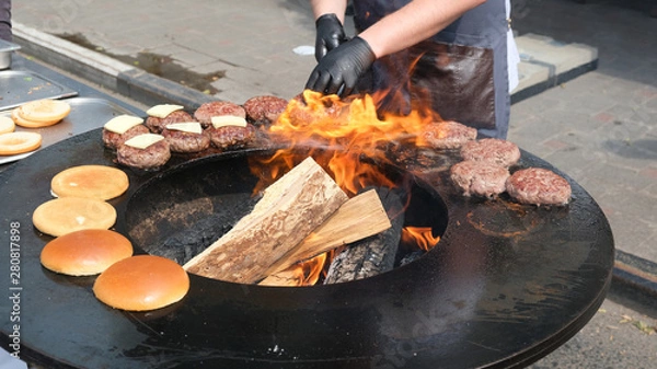Fototapeta Georgian cuisine, cooking beef steaks on an open fire
