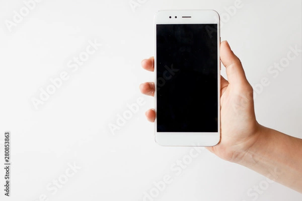 Fototapeta Smartphone in hand, blank screen mock up on white background