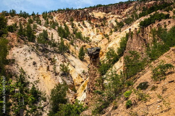 Fototapeta Devil's town (Djavolja Varos), Sandstone structures with stones on top. Interesting rock formations made by strong erosion on Radan mountain in Serbia.