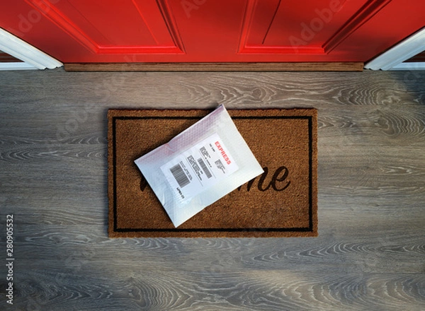 Obraz Express envelope package delivered outside door. Overhead view.