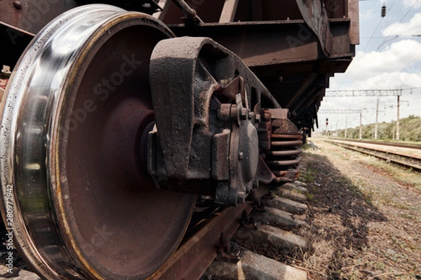 Obraz chassis, wheels of a railway car, rails - the concept of transportation and shipping