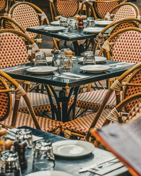 Fototapeta A row of chairs and tables at a outdoor cafe on Hardware Lane Bourke Street and Little Lonsdale Street, Melbourne, Australia