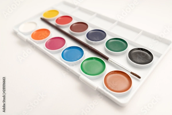Fototapeta Top view of watercolor paint in box on white background