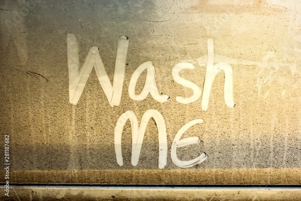 Obraz Write the words "wash me" on the very dirty surface of the car. Concept car wash.