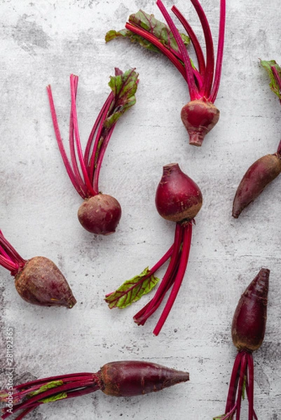 Obraz Fresh beetroots scattered over a stone background, top view