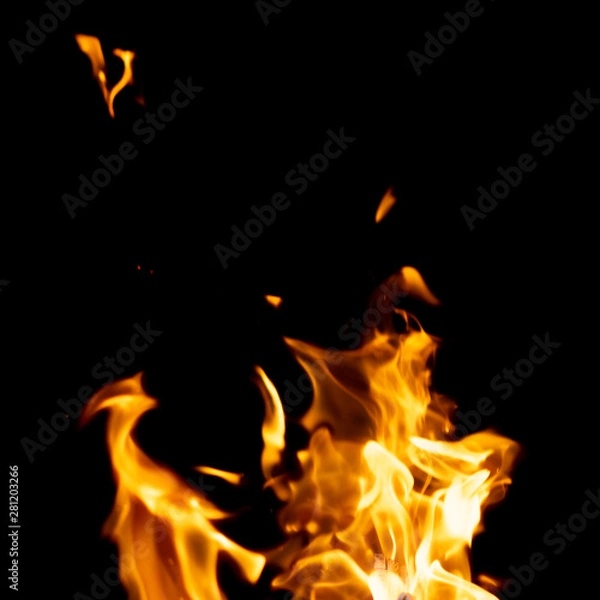 Fototapeta strong fire flames on black isolated background