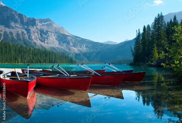 Fototapeta Canoes near the shore of Emerald Lake in Yoho National Park, Canada.