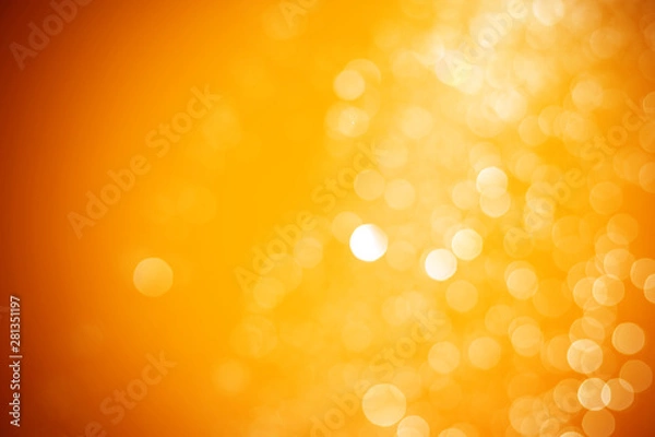 Fototapeta Streszczenie tło bokeh pomarańczowe i żółte światło. Bokeh Tła w kolorze złotym.
