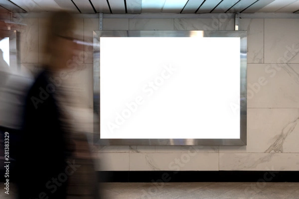 Fototapeta Mock up lightbox in underpass. Blurred movement people against background lightbox layout. Advertising in tunnel, transition.