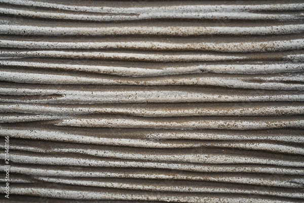 Fototapeta Background image of gray fibre glass reinforced plastic wall looking like cement texture or concrete with scratched structure made of durable, weather-proof and lightweight resin or epoxy for outdoor