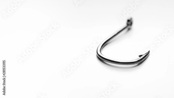 Fototapeta Fishing hook on white background, shallow depth of field