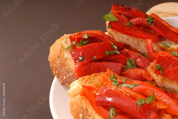 Fototapeta side view of roasted red pepper and basil bruschetta