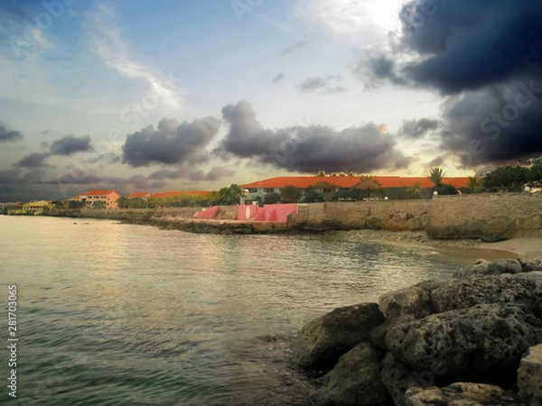 Fototapeta Dramatic skies at dusk following a brief rainstorm, as seen from Bari Reef on the gorgeous island of Bonaire. 