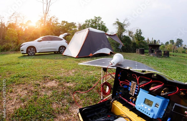 Obraz Creative solar power generation technology for camping with tent.
