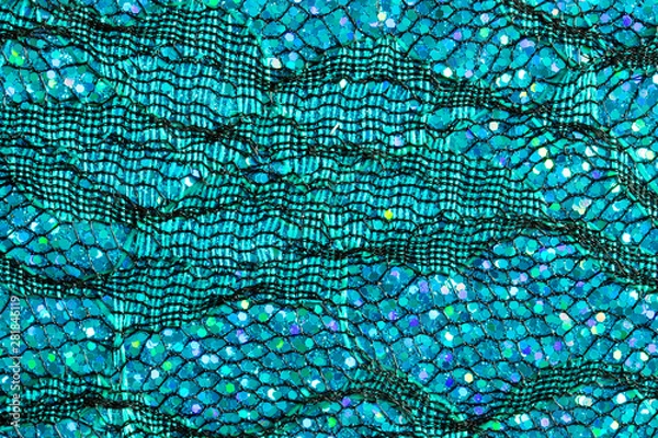 Fototapeta Abstract background of blue lace and sequins to look like the sea or fish scales