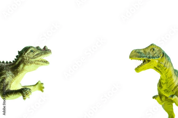 Obraz two toy dinosaurs fall into the frame from different sides