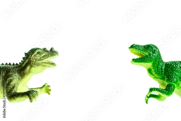 Obraz two toy dinosaurs fall into the frame from different sides
