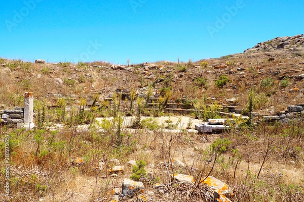 Obraz view of the small theater of Syrian divinities in the archaeological city of Delos Island, near Mykonos, beautiful Cycladic island, in the heart of the Aegean Sea.