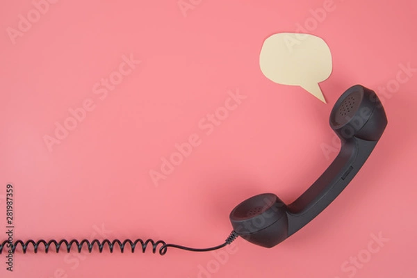 Fototapeta Handset phone with speech bubble on a pink background. With place for text. Copy space