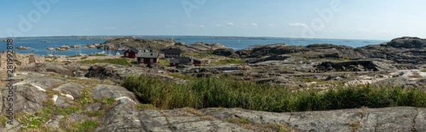 Fototapeta Ursholmen, Sweden - July 26, 2019: View of the red houses on Ursholmen Island in the Swedish Kosterhavet National Park in western Sweden.