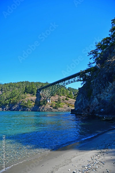 Fototapeta The Deception Pass Bridge as seen from Little North Beach in Deception Pass State Park in Washington State