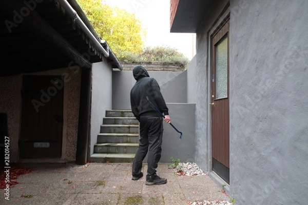Obraz Burglar in black clothes
