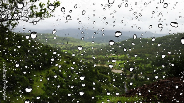 Fototapeta Mountain view from Glass window during rain