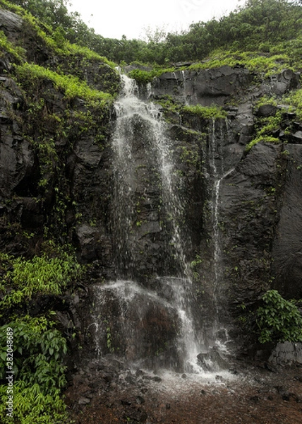 Fototapeta Waterfall mountain with rain clouds view