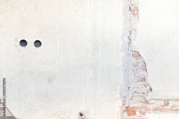 Obraz Old wall with paint, bricks, holes and crack on it that can be used as background or texture