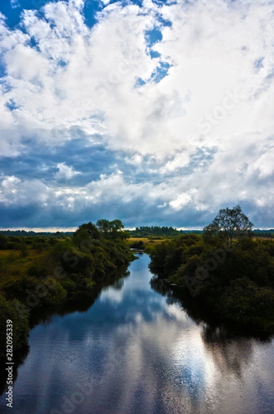 Fototapeta landscape with river and clouds