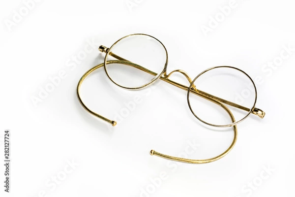 Obraz golden glasses isolated on white background