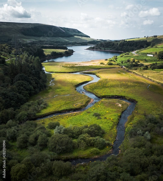 Fototapeta Stunning Peak District National Park Aerial shot at the Woodhead to Torside reservoirs showing the streams of water connecting the two