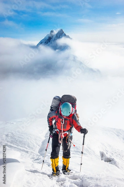 Fototapeta Climber reaches the summit of Everest, Nepal.