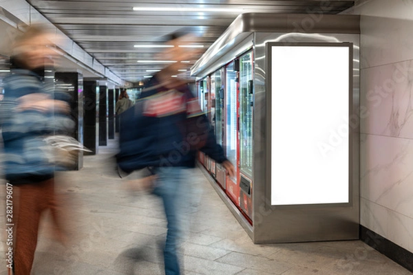 Fototapeta Mock up lightbox in underpass. Blurred movement people against background lightbox layout. Advertising in tunnel, transition.