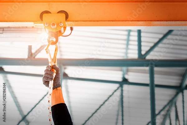 Fototapeta Construction worker wearing safety harness and safety line working high place at industrial.
