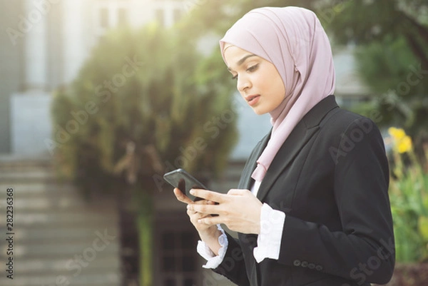Obraz business woman using smart phone.