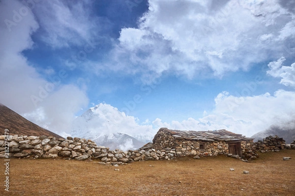 Fototapeta A View of Amphu Gyabjen and Ama Dablan peaks with Old Stone Hut, Everest base camp trek, Nepal