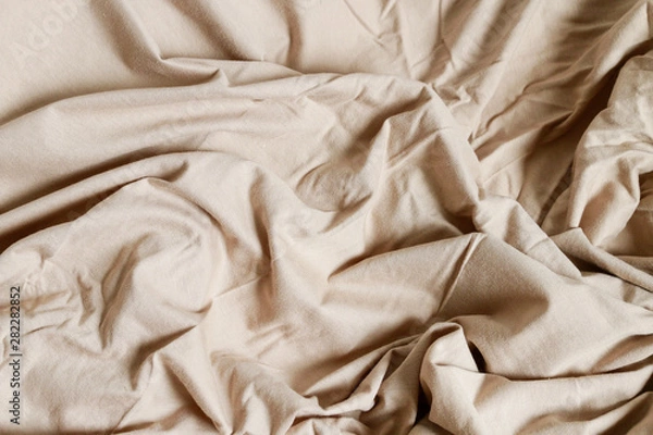 Fototapeta Beige bedsheet background.