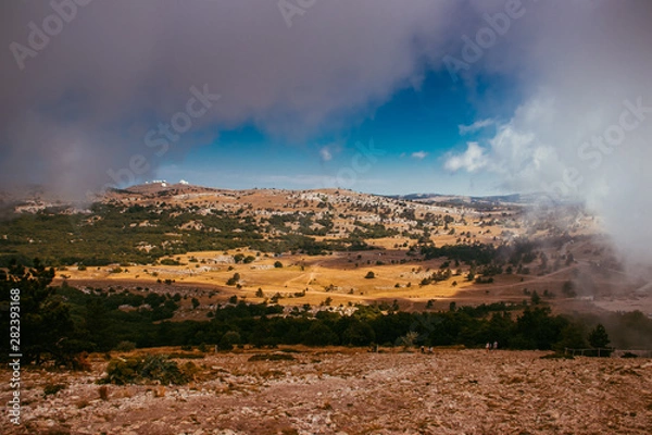 Fototapeta Ai-petri mountain in the fog. High mountain. Crimea. Russian mountains. Low clouds. Beautiful mountain landscape. The famous AI Petri mountain, partially covered with clouds, fog