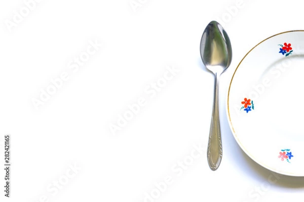 Obraz designer fragments of the served table for eating. Fork, spoon and plate - simple breakfast, lunch or dinner.