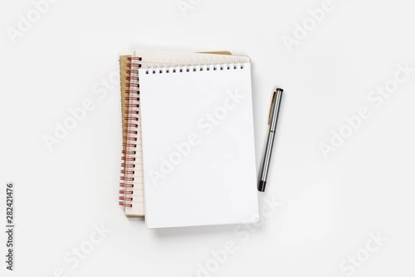 Obraz school notebook on a white background, spiral notepad on a table.