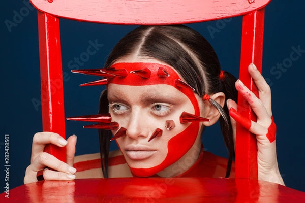 Obraz Portrait of an extraordinary model with creative makeup and hair. Studio photo session