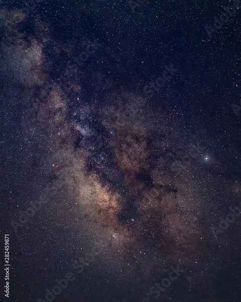 Fototapeta Details of the Milky Way with visible nebulae clouds