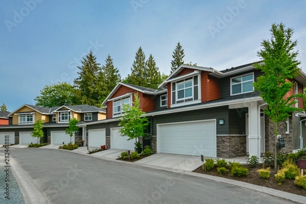 Obraz Street of brand new residential triplex houses ready for moving in