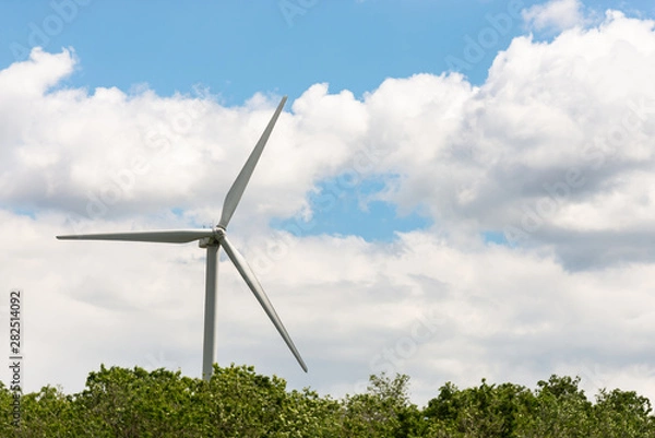 Fototapeta Alternative energy source. Windmill against the sky. Wind turbine in Austria.