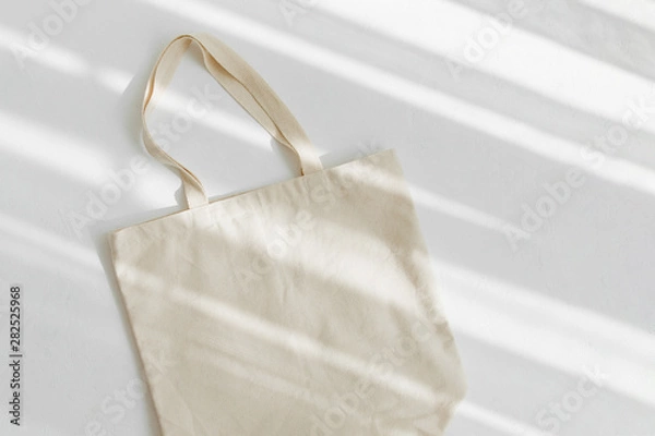 Fototapeta White eco bag mockup. Blank Shopping sack with copy space. Canvas tote bag. Eco friendly / Zero waste concept.