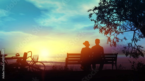 Fototapeta Couple on a bench watching the ocean after a bike ride