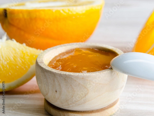Obraz Orange jam served in spoon on the table