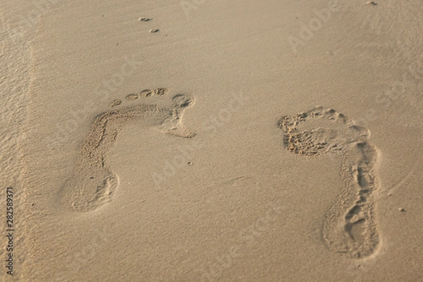 Obraz close up of footprints on the beach with golden sand